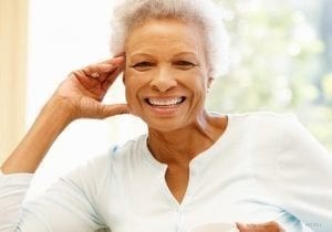 Smiling Elderly Woman in Sunlight