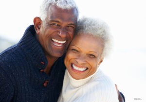 Happy African-American Couple Smiling and Embracing